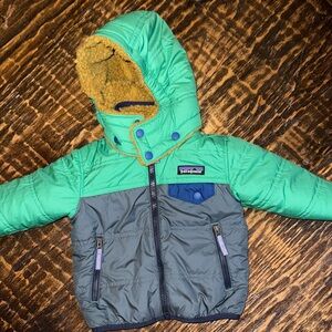 Patagonia Teal and Charcoal Jacket with Mustard Lining